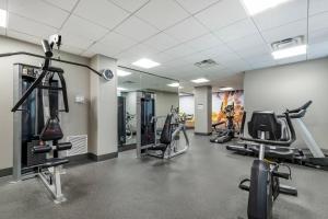 a gym with several treadmills and cardio machines at Hotel 1914 - Historic Alamo Riverwalk, an Ascend Collection Hotel in San Antonio +6 photos