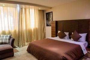 Кровать или кровати в номере Li Tour International Hotel