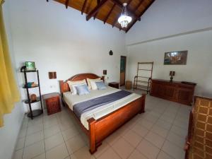 Postel nebo postele na pokoji v ubytování Sanka Rest Ayurvedic Home Stay