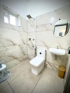 Koupelna v ubytování Tokyoz Inn Calicut + 21 fotografií