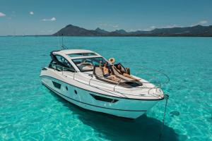 a group of people laying on a boat in the water at Villa du lagon et du Nautique o693-70-59 79 in Saint-Leu