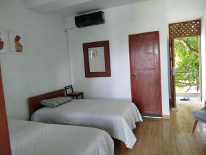 Postel nebo postele na pokoji v ubytování Habitación Casa Wayllu Pucallpa