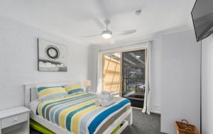 Postel nebo postele na pokoji v ubytování Shell Cove by Charlesworth