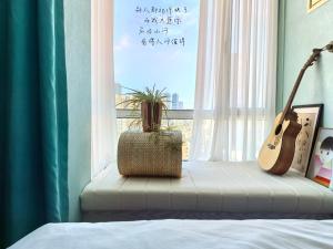 Postel nebo postele na pokoji v ubytování Meizuo Seaside Residence, near the seaside + 10 fotografií