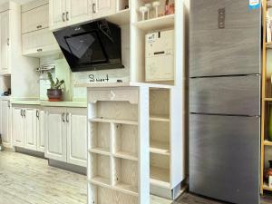 Kuchyň nebo kuchyňský kout v ubytování Meizuo Seaside Residence, near the seaside