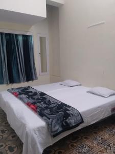 En eller flere senge i et værelse på ganga kashi niwas