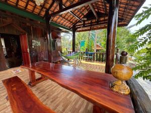a large wooden table in the middle of a room at Cat Tien Vista in Tân Phú