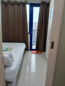 Postel nebo postele na pokoji v ubytování Rosaland staycation