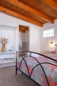 a bedroom with a bed and a window at Al Quindici in Gaeta