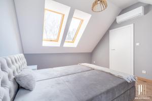 En eller flere senge i et værelse på Green Wood Prestige House