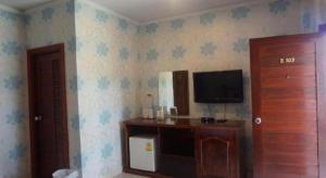 a room with a tv on the wall and a room with a door at The Park Nangrong Resort in Nang Rong +79 photos