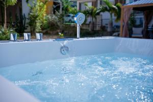a jacuzzi tub with a water fountain in it at Villa MILA ONNA in Onna