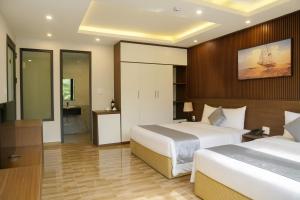 Una cama o camas en una habitación de An Tín Hotel