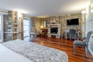 TV a/nebo společenská místnost v ubytování Hotel Restaurant Lesage