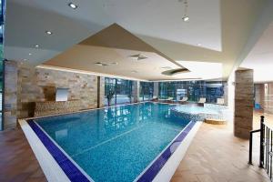 a large swimming pool in a hotel room at Sunlit Forest Suite in Borovets