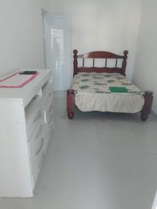 En eller flere senge i et værelse på Suíte jambo