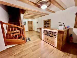 a large room with a staircase and a tasting room at Valtnerhof in San Candido