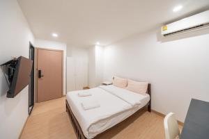 Giường trong phòng chung tại We Inn