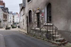 a building with stairs on the side of a street at Hôtel Du Bellay in Blois +28 photos