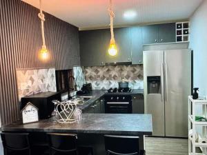 Kuchyň nebo kuchyňský kout v ubytování Tropical Nest