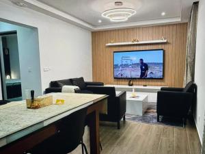 TV a/nebo společenská místnost v ubytování Tropical Nest