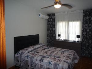 Ένα ή περισσότερα κρεβάτια σε δωμάτιο στο AguaMarina Golf Del Sur