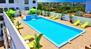 a large swimming pool on the roof of a building at Cosy-Piscine-Parking in Casablanca