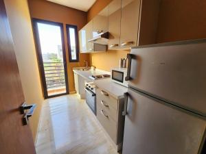 Køkken eller tekøkken på Cosy-Piscine-Parking