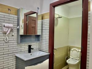 a bathroom with a sink and a toilet at AP Home in Ho Chi Minh City