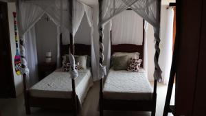 En eller flere senge i et værelse på Casa Terravista Trancoso + 37 billeder