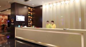two men standing at a counter in a store at Zmax Changzhi Bayi Square in Changzhi