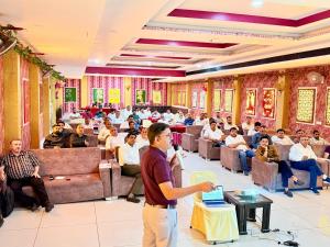 a man standing in front of a crowd of people at Hotel Goodwill in Kaithal +2 photos