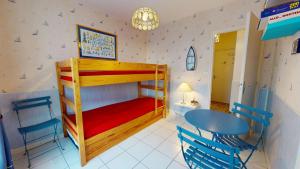 En eller flere senge i et værelse på Le Coin du Large