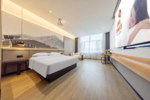 Ένα ή περισσότερα κρεβάτια σε δωμάτιο στο Jin Yi Youxuan Hotel Ulanqab Wanda Branch 2 +93 φωτογραφίες