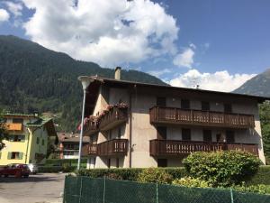 a building with balconies on the side of it at Pinzolocasa in Pinzolo