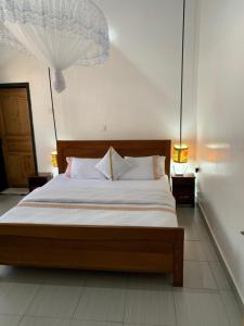 Postel nebo postele na pokoji v ubytování URUGANO VIRUNGA PALACE