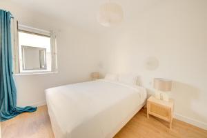 En eller flere senge i et værelse på Maison 5 pièces 10 min de Paris