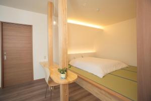 Ένα ή περισσότερα κρεβάτια σε δωμάτιο στο Ryokan Mokuzin +34 φωτογραφίες