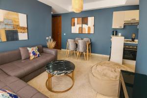 a living room with a couch and a table at Cozy 2-bedroom studio in Casablanca