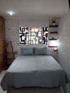 En eller flere senge i et værelse på La tranquera