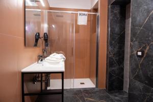 Ванная комната в Kora Rooms