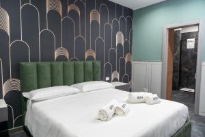 Кровать или кровати в номере Kora Rooms +15 фотографий