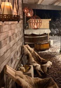 a cow eating food from a bowl in a building at VillaVasa Original in Transtrand