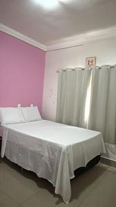 Ένα ή περισσότερα κρεβάτια σε δωμάτιο στο Cantinho Abençoado