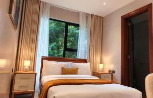 Postel nebo postele na pokoji v ubytování The Meru House