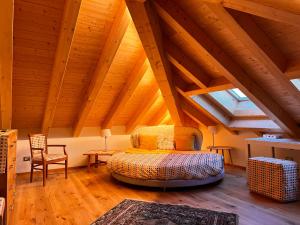 En eller flere senge i et værelse på Chalet Le Dimore Asiago - Ideale per gruppi e Famiglie