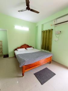 Postel nebo postele na pokoji v ubytování Patliputra Vihar