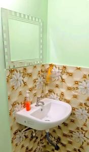 Koupelna v ubytování Patliputra Vihar + 4 fotografie