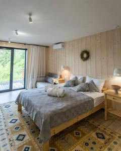 a bedroom with a large bed in a room at Samatha space in Slavske