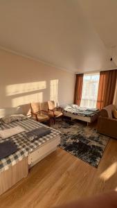 Una cama o camas en una habitación de Apartment Bosteri Beach